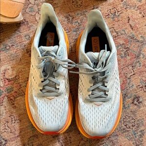 Hoka women’s Light Gray and Orange Athletic Shoes